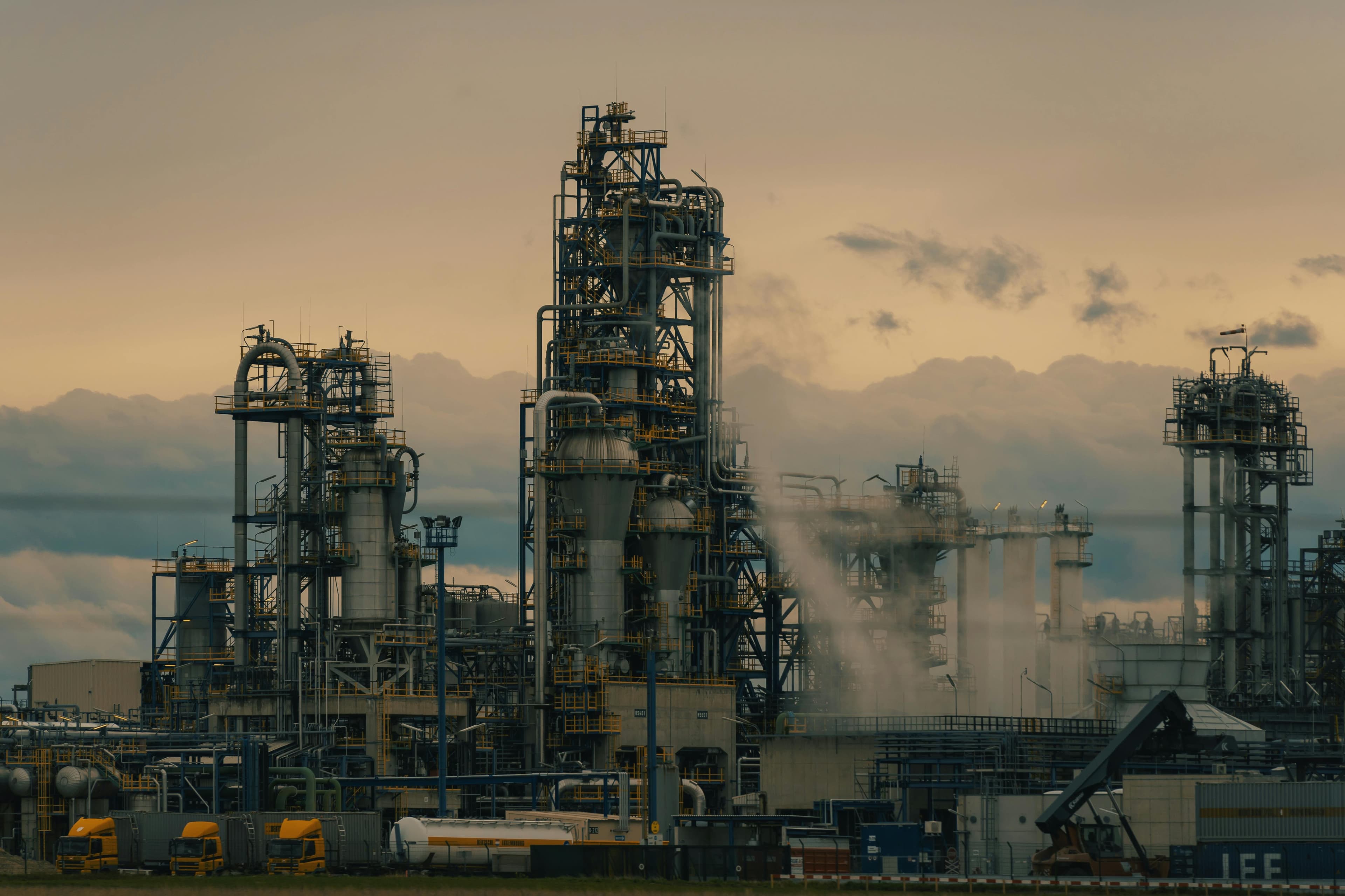 Oil rig offshore platform at sunset
